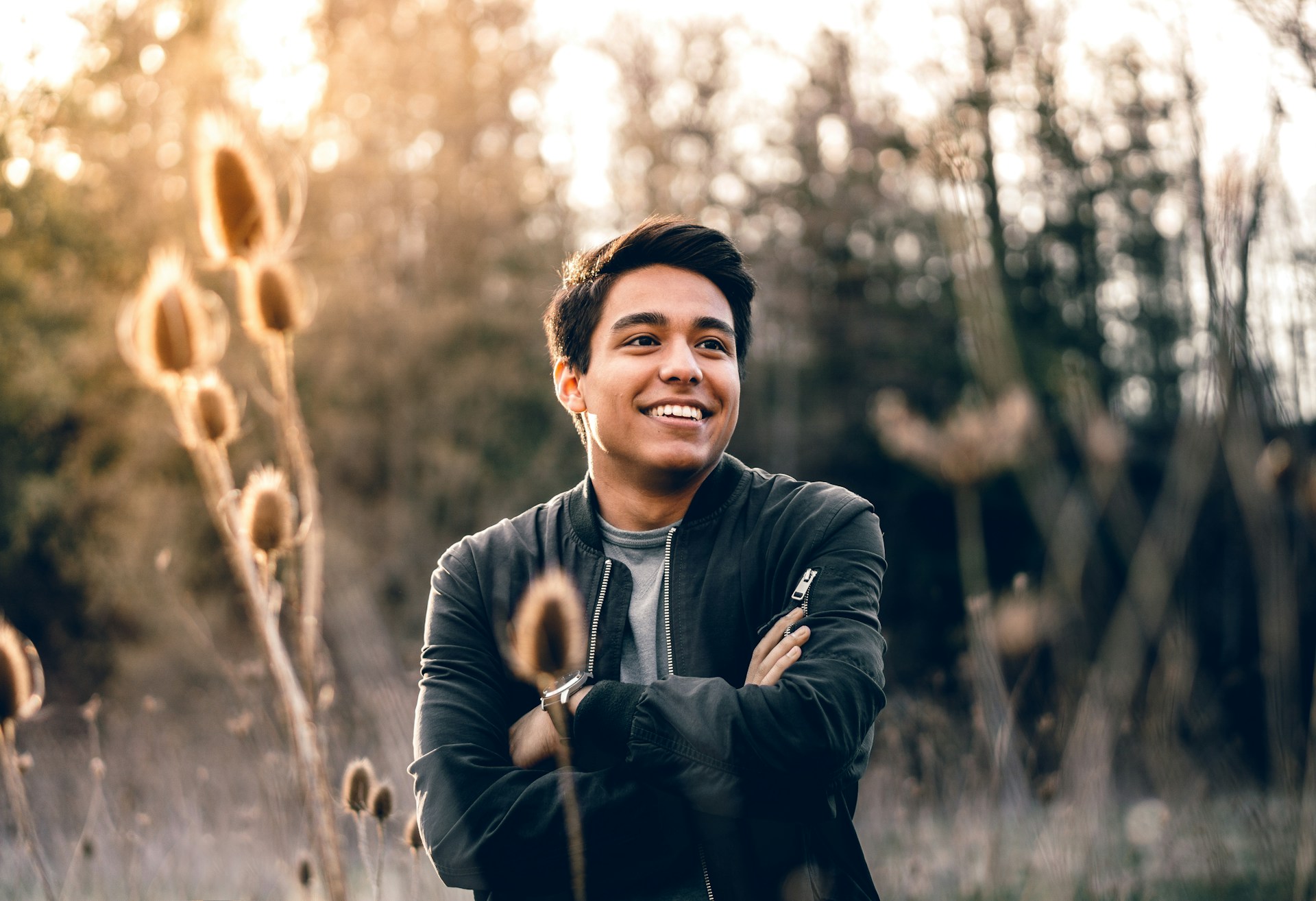 The recovering, man in his twenties outdoors in evening light, well again